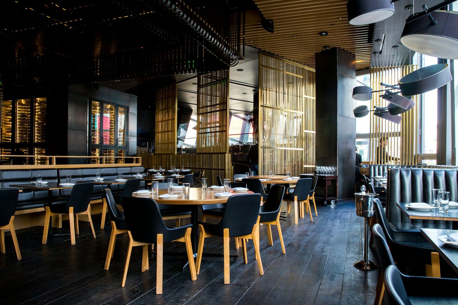 A busy restaurant dining room in the evening.